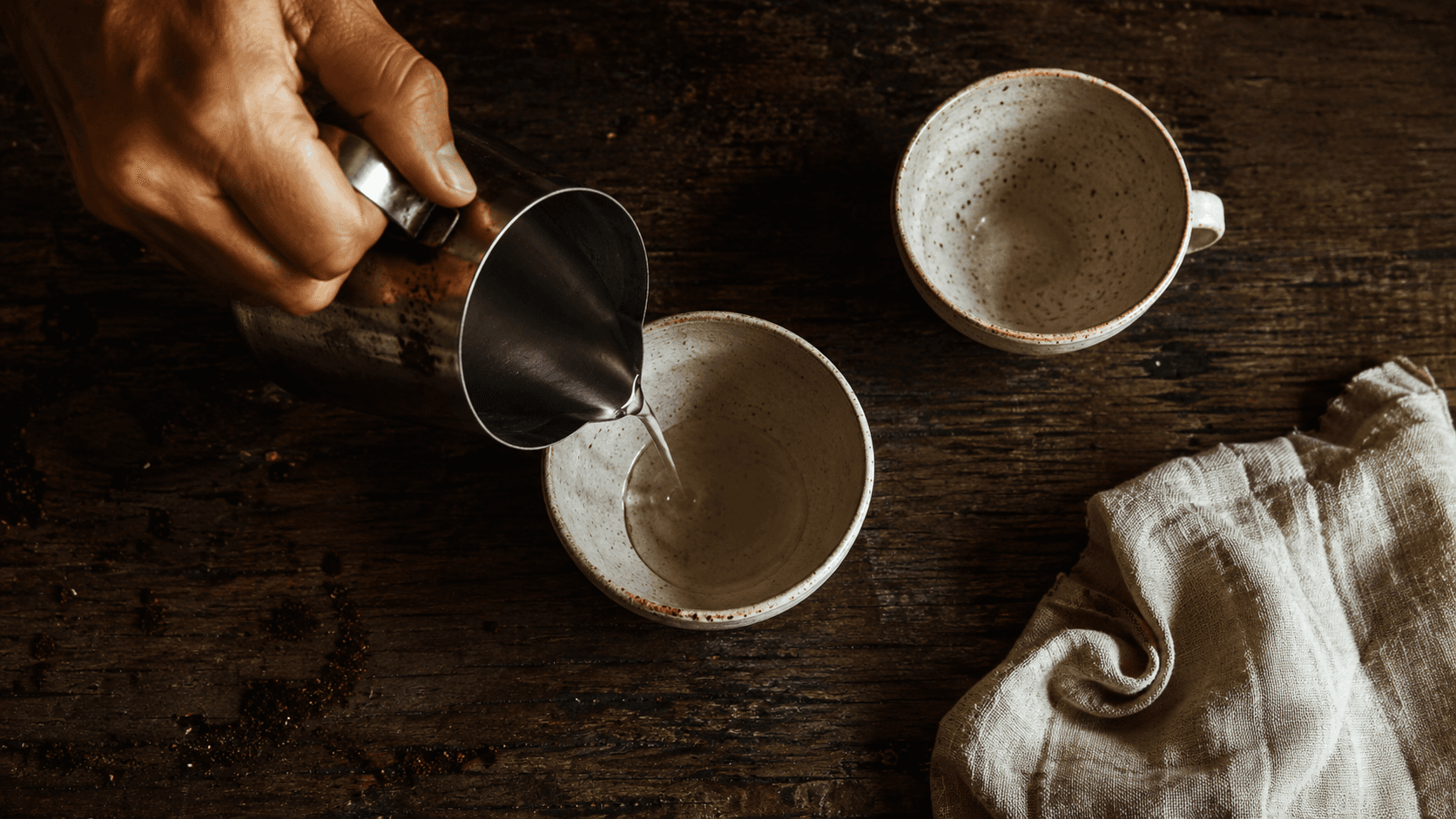 Latte art practice setup with pitcher and cup — low-waste training drills