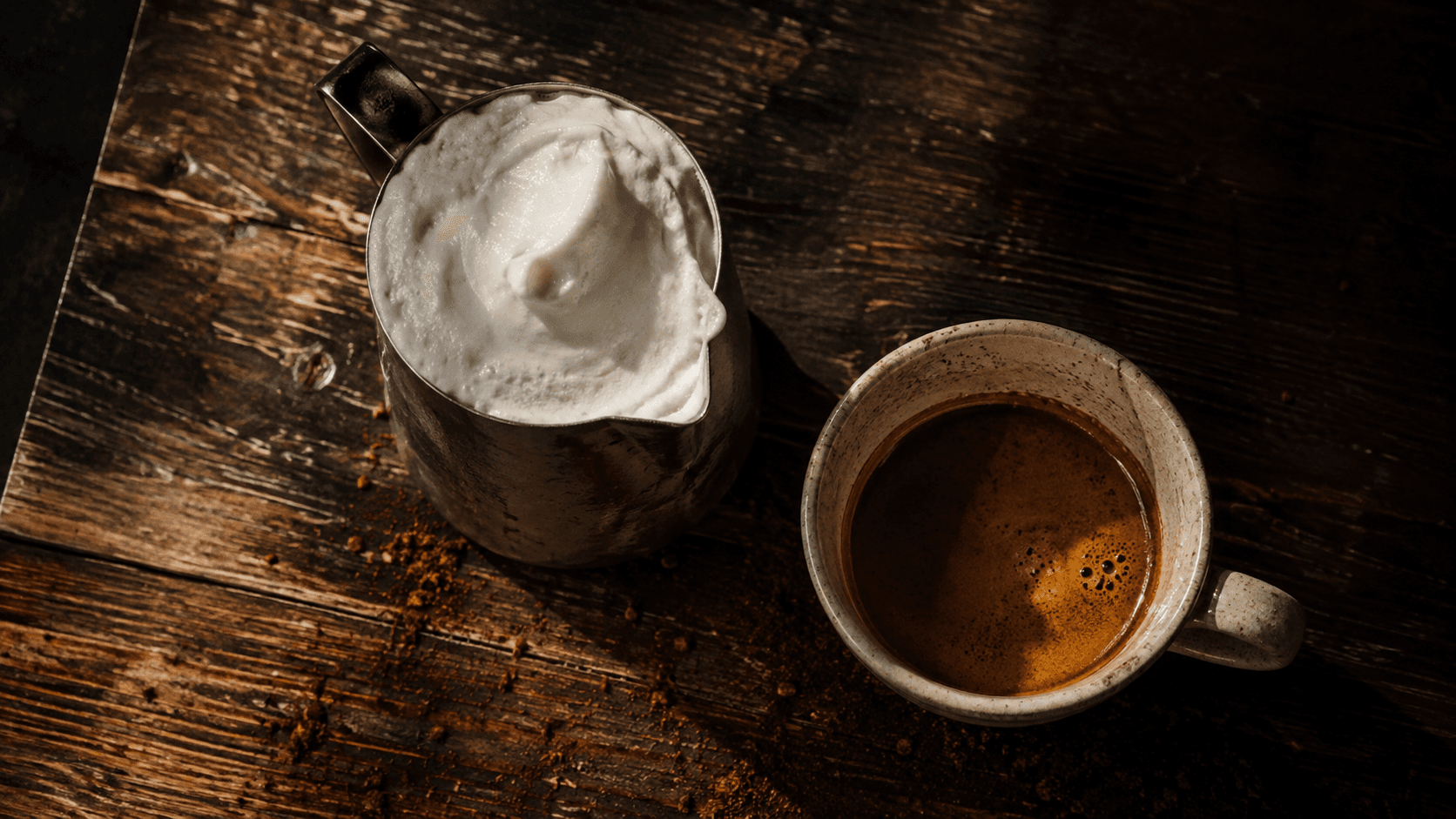 Milk pitcher showing overly stiff foam that won't pour — too much stretching