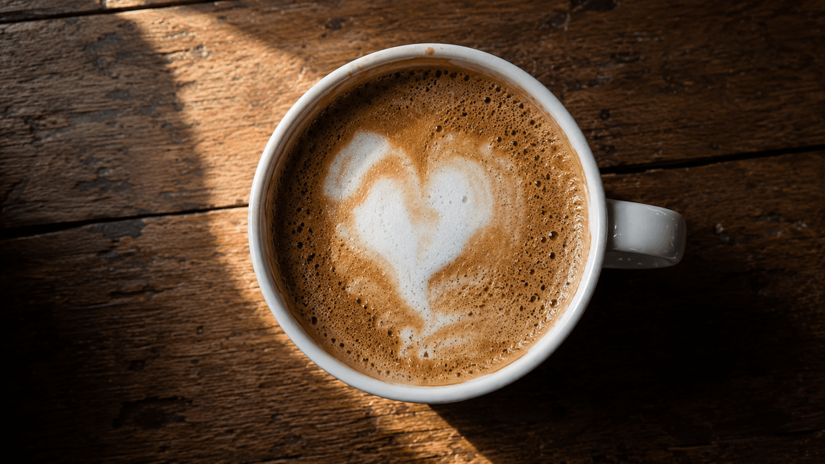 Latte art heart with uneven edges and low contrast — common beginner mistake