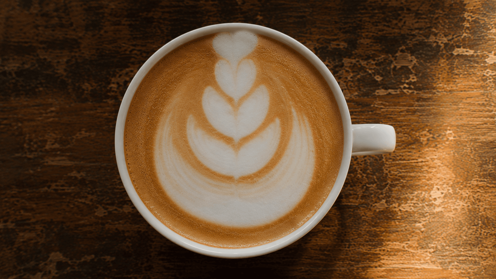 Latte art 4-tulip with cramped, merged layers — common intermediate mistake