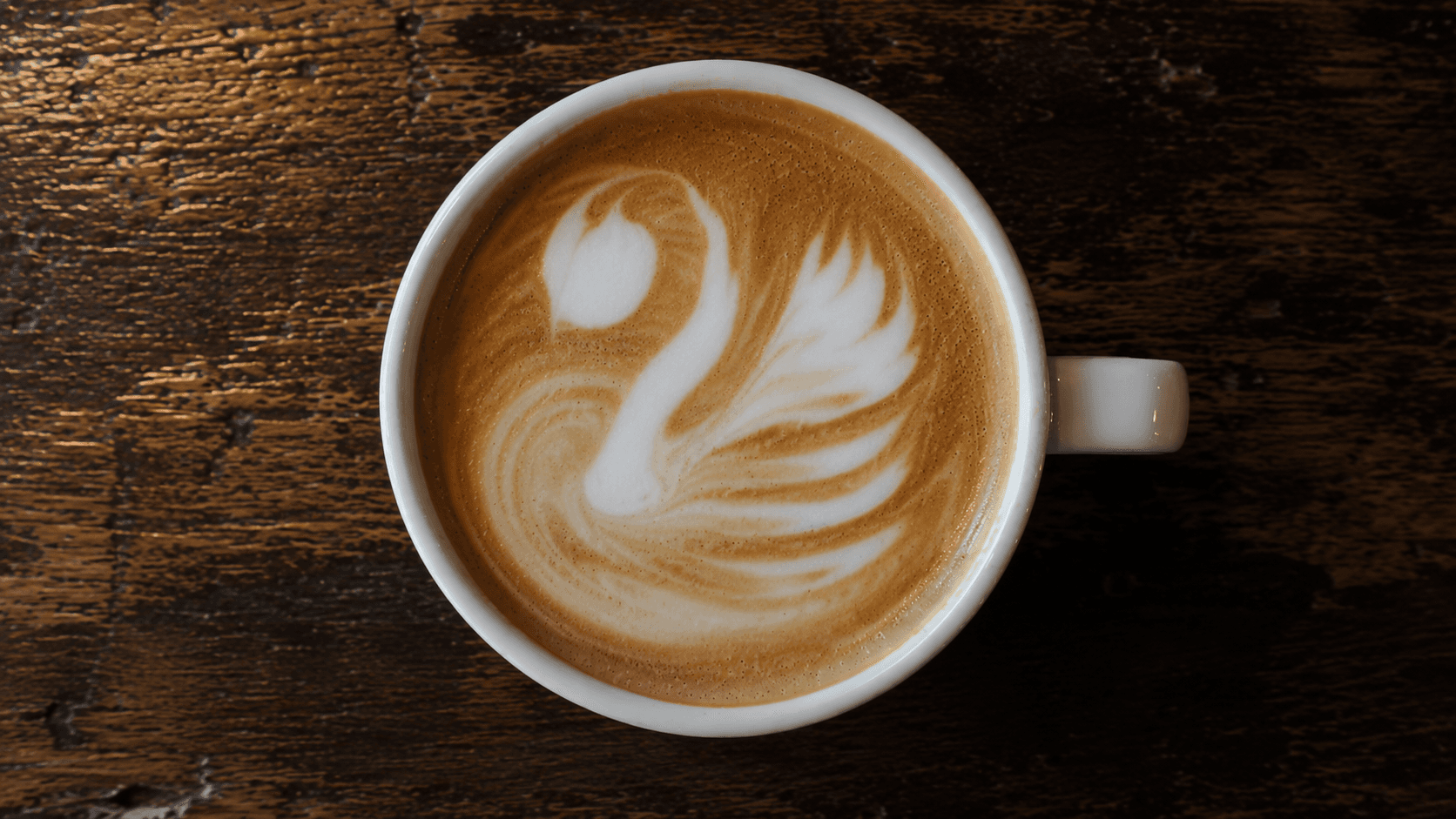 Latte art swan with weak body, straight neck and oversized head drop — common advanced mistake